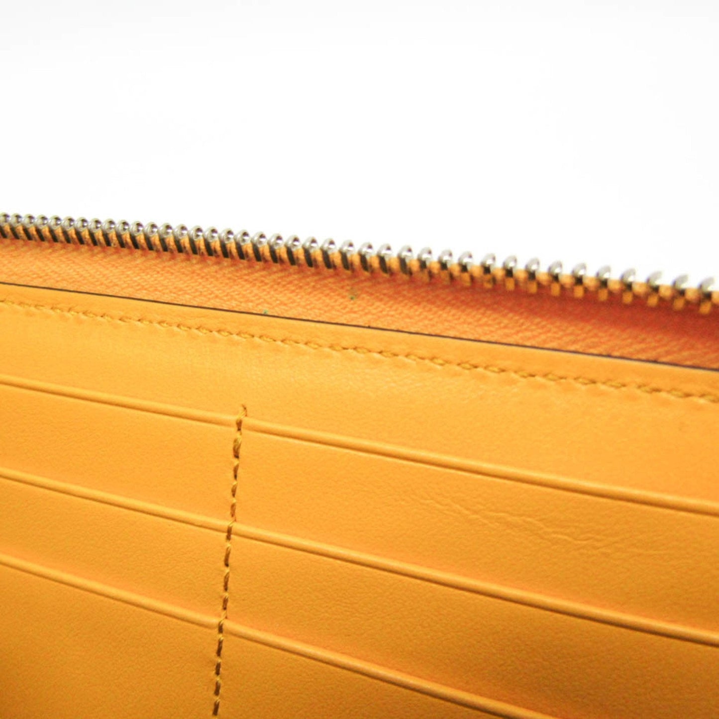 Gucci Gg Embossé Yellow Leather Wallet ()