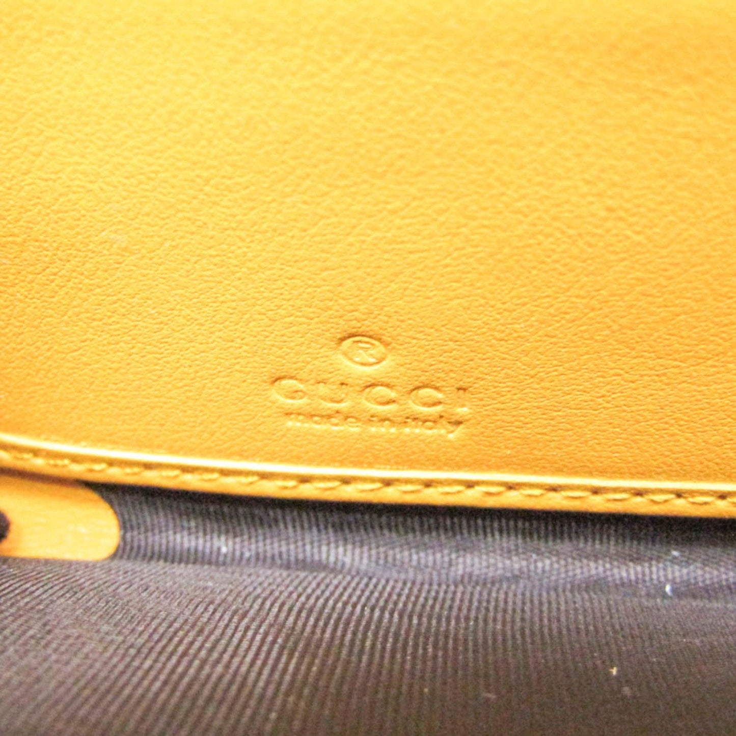 Gucci Gg Embossé Yellow Leather Wallet  ()