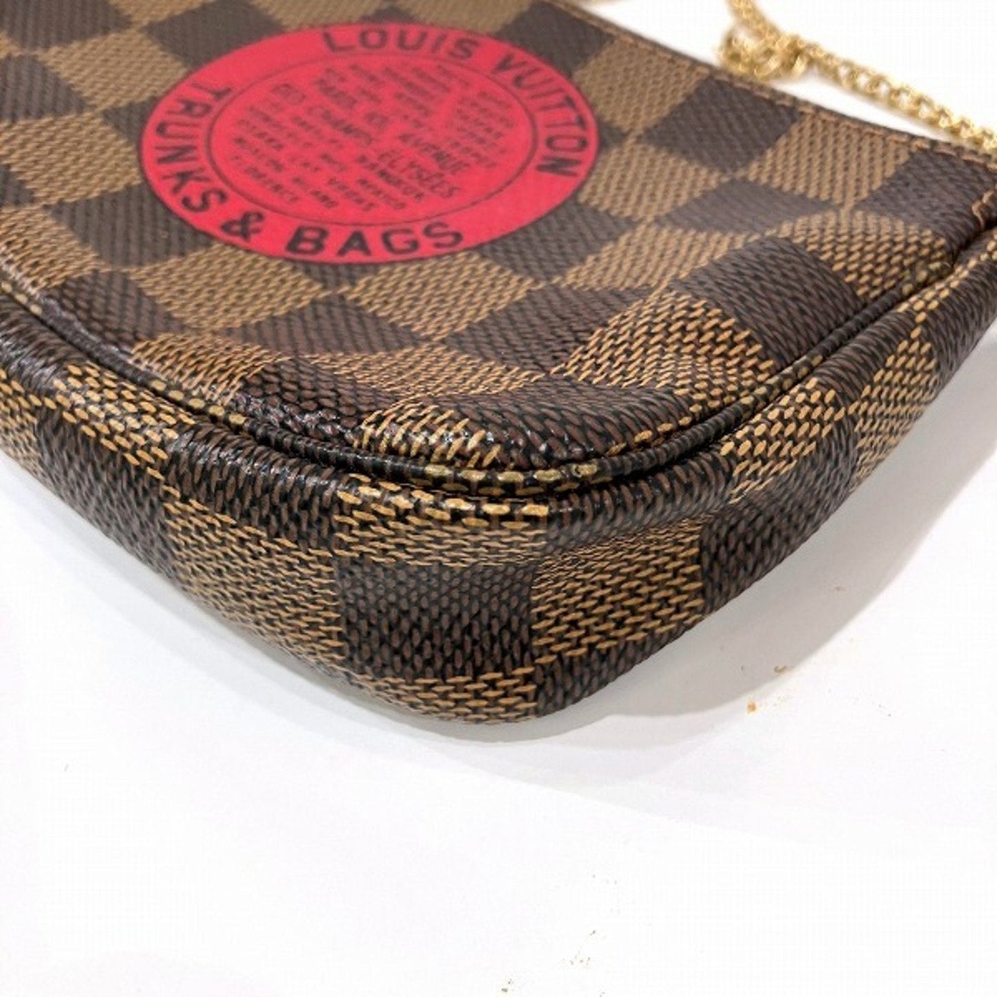 Louis Vuitton Mini Pochette Accessoires  Canvas Clutch Bag ()