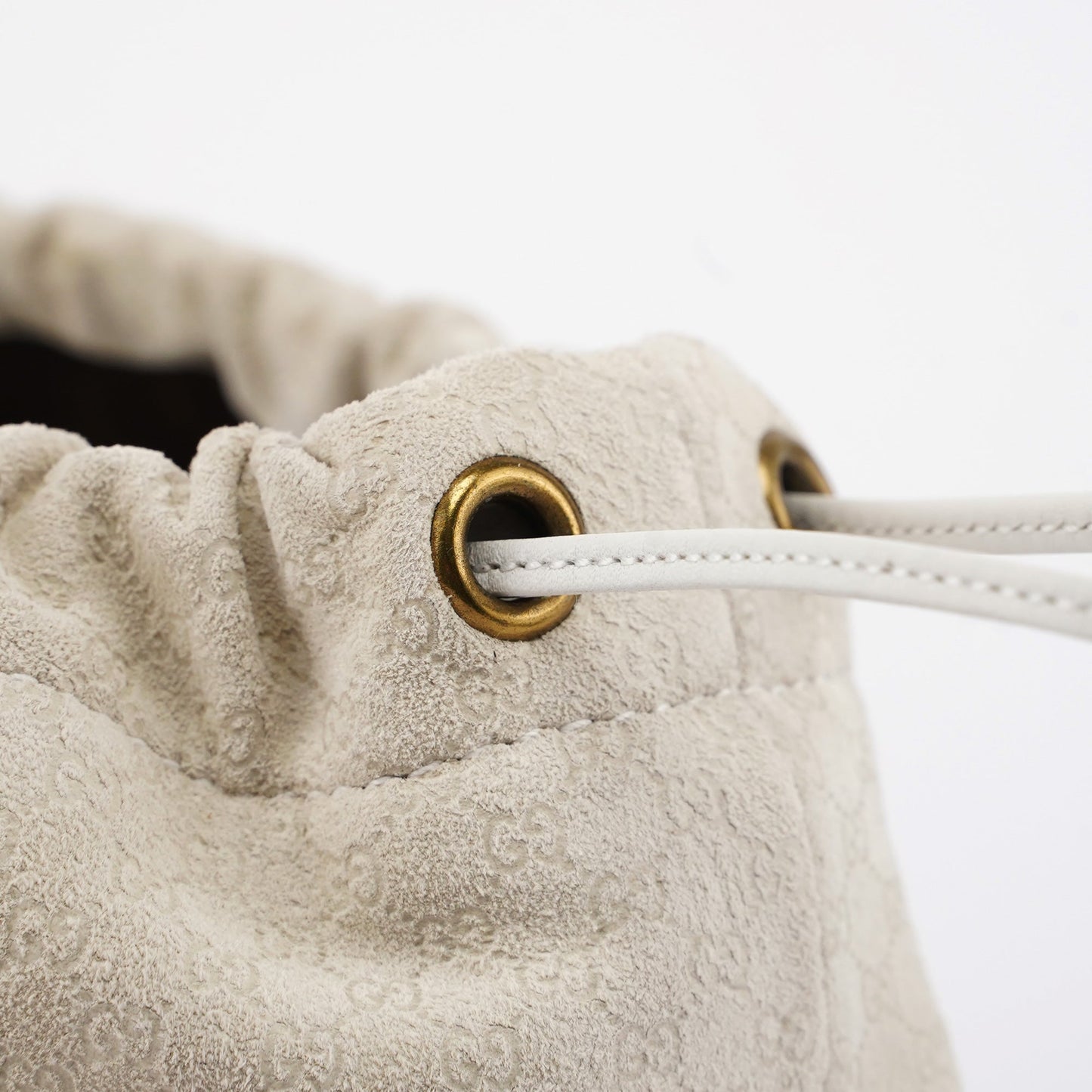 Beige Perforated Leather Drawstring Bag